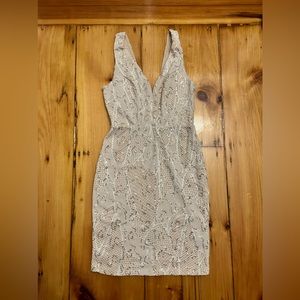 A white with gold sequins a v-neck sheath dress!